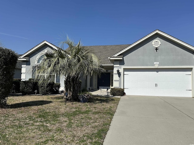 ranch-style house with an attached garage, concrete driveway, and stucco siding