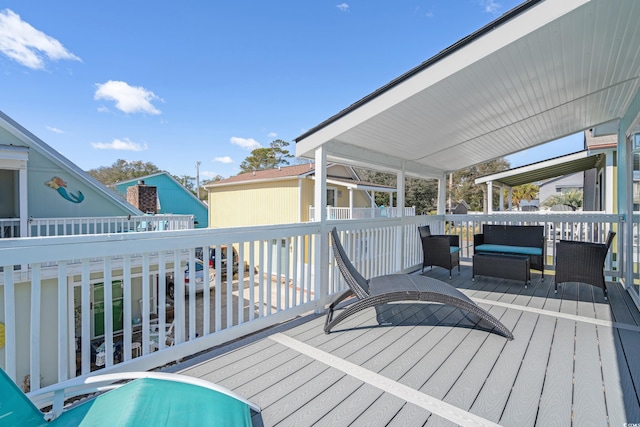 wooden terrace with outdoor lounge area