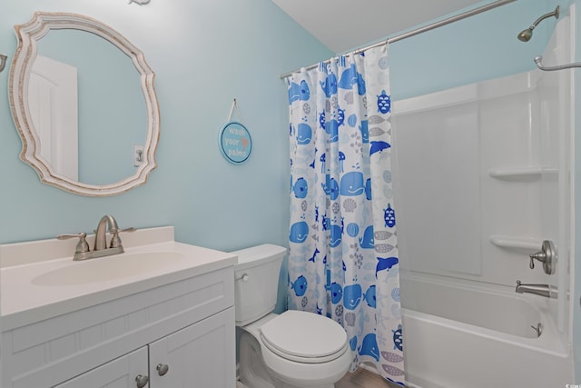 full bath featuring toilet, shower / bath combo with shower curtain, and vanity