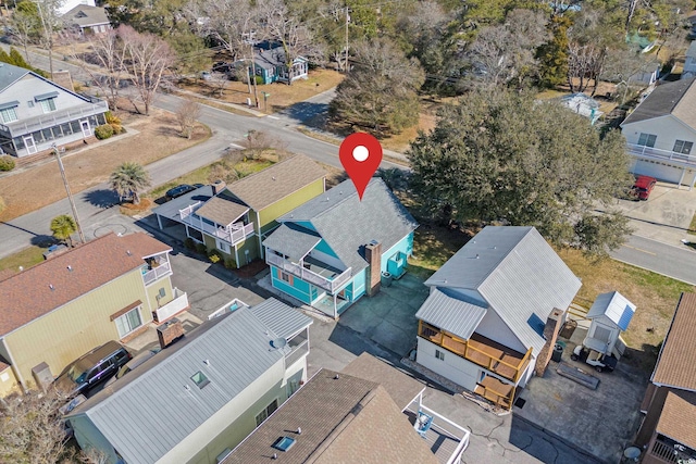 birds eye view of property with a residential view