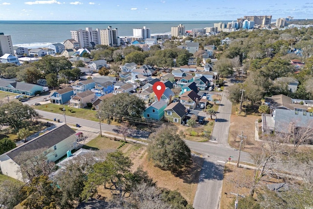 birds eye view of property featuring a water view and a city view