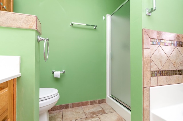 bathroom with tile patterned flooring, toilet, vanity, a shower stall, and a bath