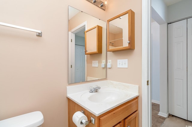 bathroom with vanity and toilet