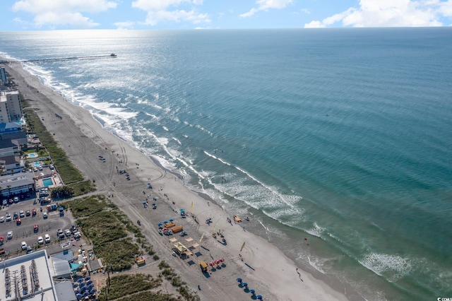 bird's eye view featuring a water view and a view of the beach