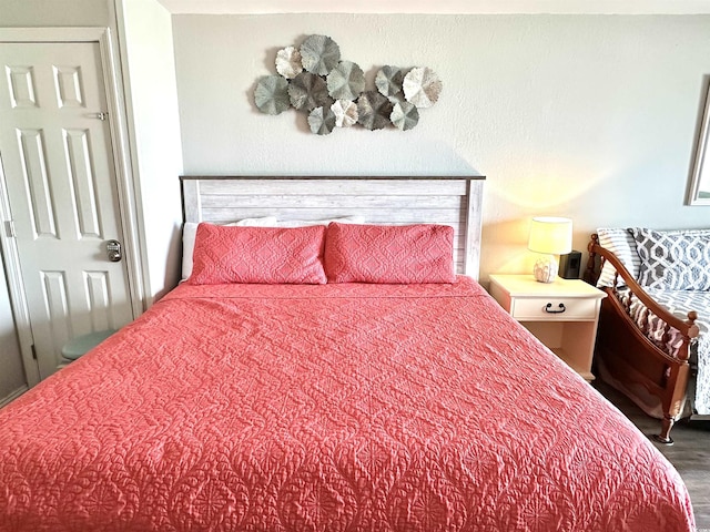 bedroom featuring wood finished floors