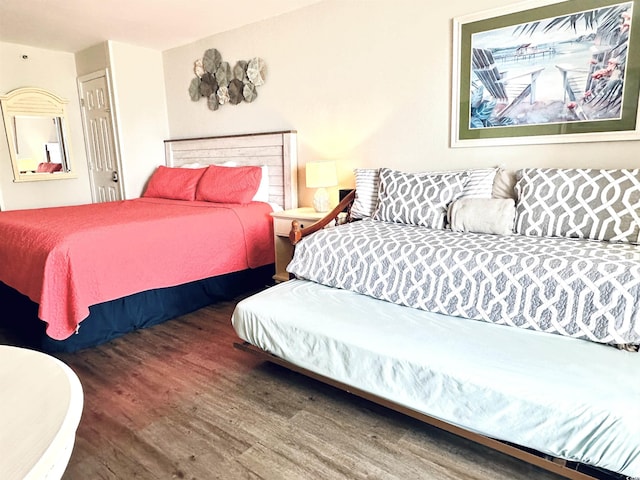 bedroom with wood finished floors