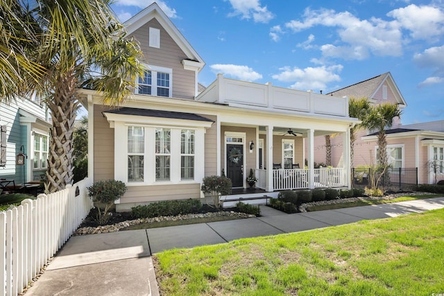 view of front of home featuring fence and a porch