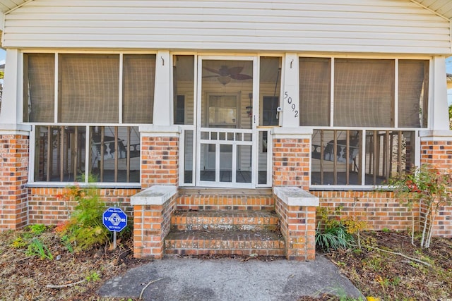 property entrance with brick siding