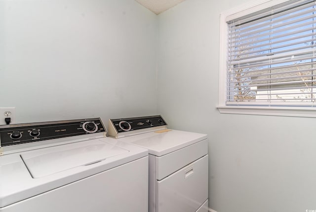 laundry room featuring laundry area and separate washer and dryer