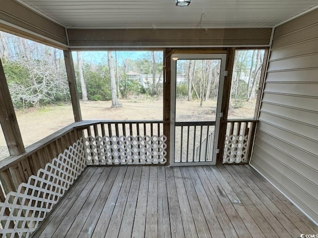 unfurnished sunroom featuring a wealth of natural light