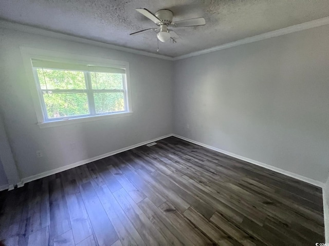 spare room with baseboards, dark wood finished floors, a textured ceiling, and ornamental molding