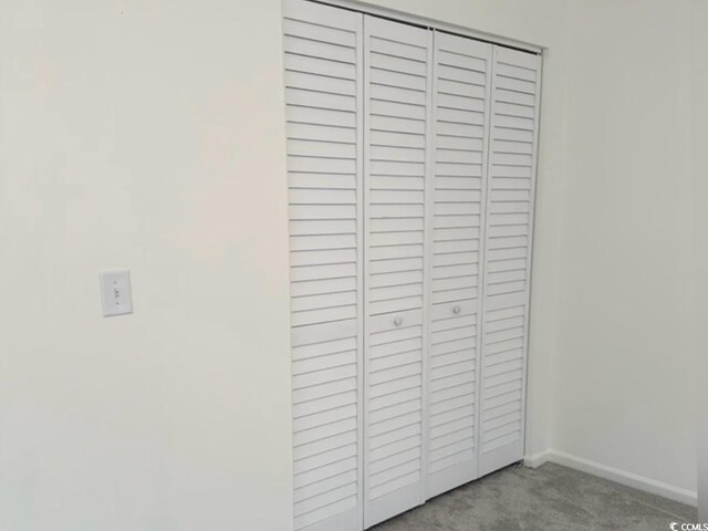 room details featuring carpet and baseboards