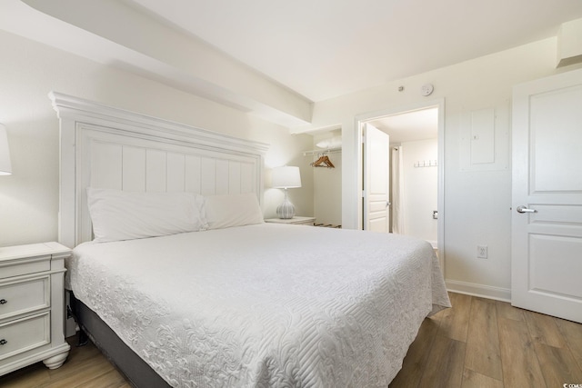 bedroom featuring light wood-style floors