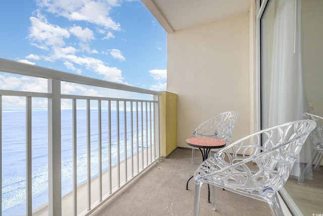 balcony featuring a water view