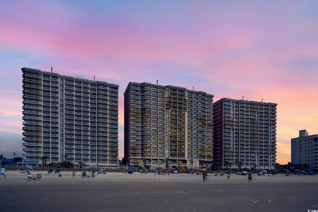 view of property with a view of city and a water view