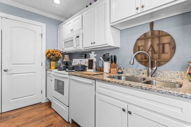 kitchen with white cabinetry, white appliances, ornamental molding, and a sink