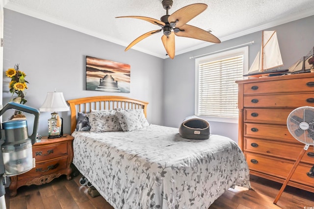 bedroom with ceiling fan, dark wood-type flooring, ornamental molding, and a textured ceiling