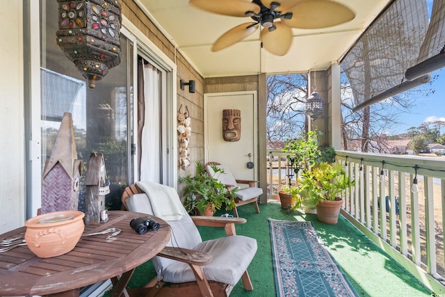 balcony with a ceiling fan and a sunroom