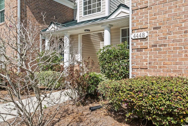 entrance to property with brick siding