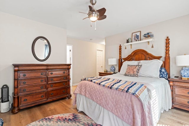 bedroom featuring light wood finished floors and ceiling fan