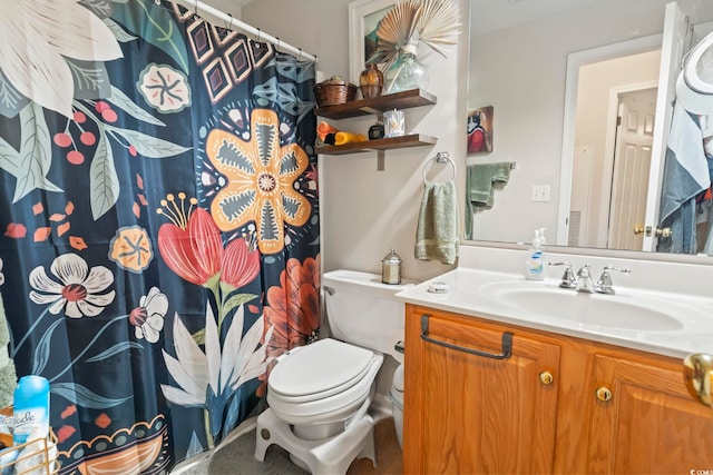 bathroom with a shower with shower curtain, vanity, and toilet