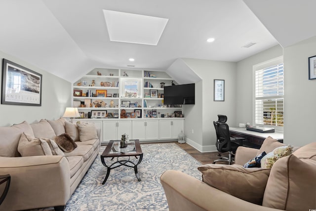 living room featuring built in shelves, baseboards, dark wood-style flooring, recessed lighting, and a skylight