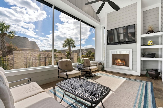 sunroom / solarium featuring wood finished floors