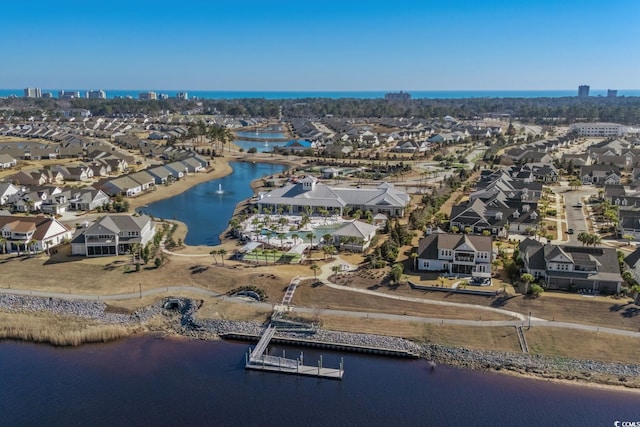 bird's eye view with a water view and a residential view