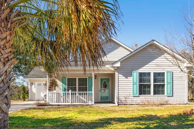 view of front of house with an attached garage, a front lawn, a porch, and concrete driveway