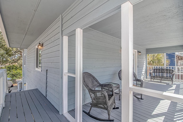 wooden deck featuring a porch