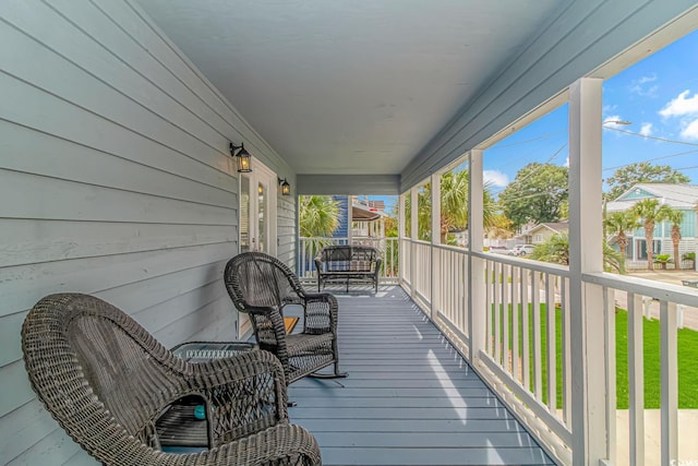 wooden deck with a residential view