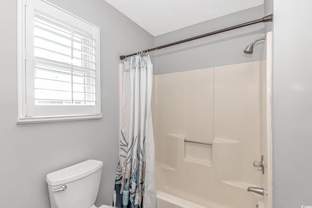 full bathroom with toilet and shower / bath combo with shower curtain