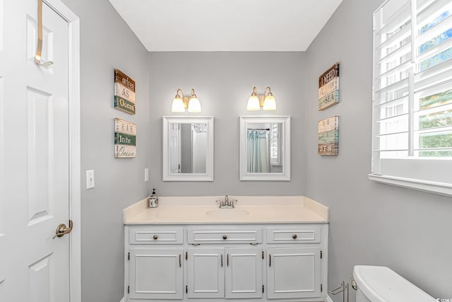 bathroom with vanity and toilet