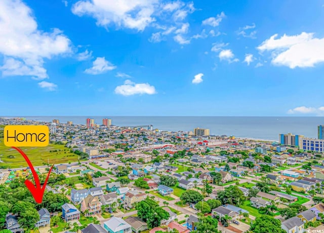 drone / aerial view with a water view and a view of city