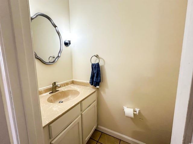 bathroom featuring baseboards, vanity, and tile patterned flooring