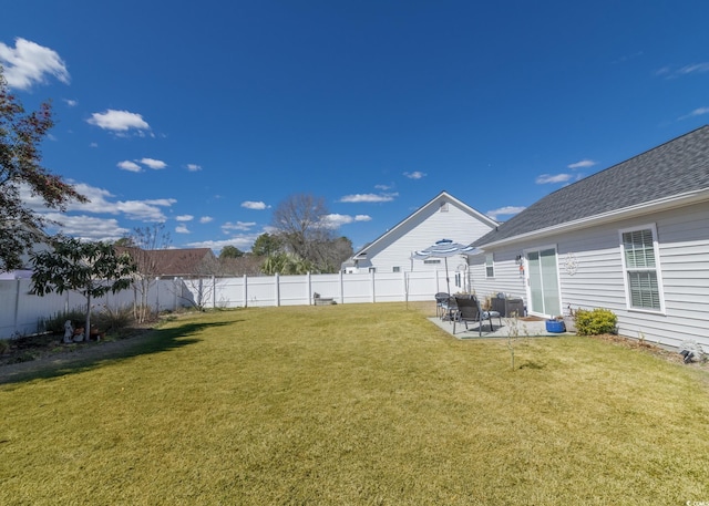 view of yard featuring a patio area and a fenced backyard