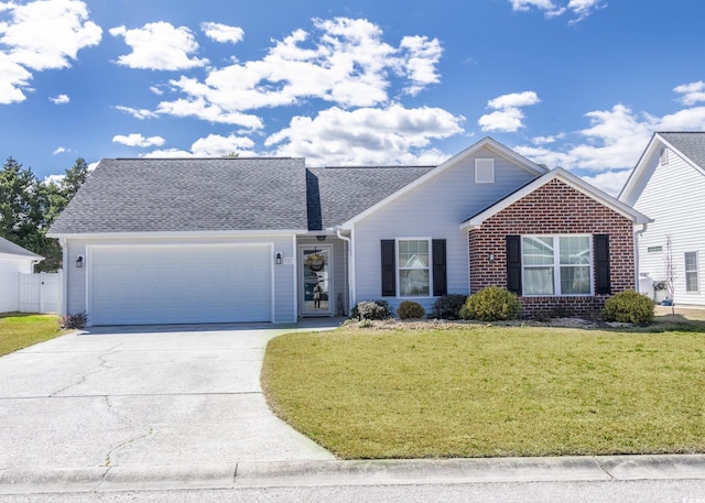 view of front of house with a garage, a shingled roof, concrete driveway, a front lawn, and brick siding