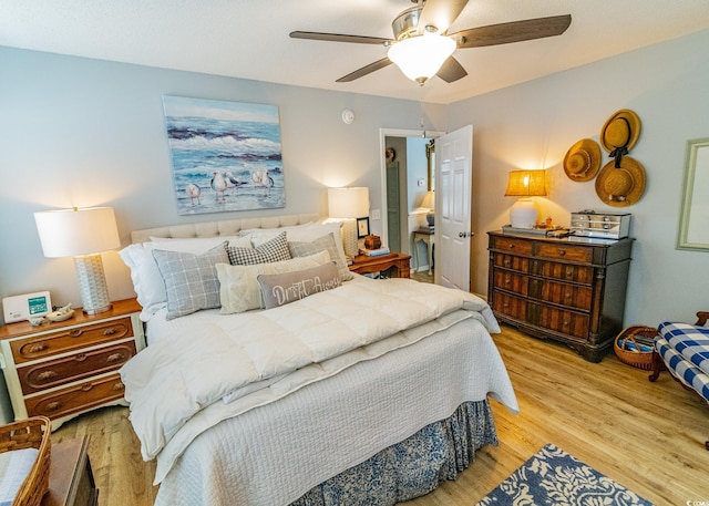 bedroom with ceiling fan and wood finished floors