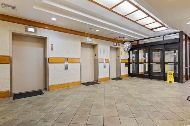 building lobby featuring visible vents