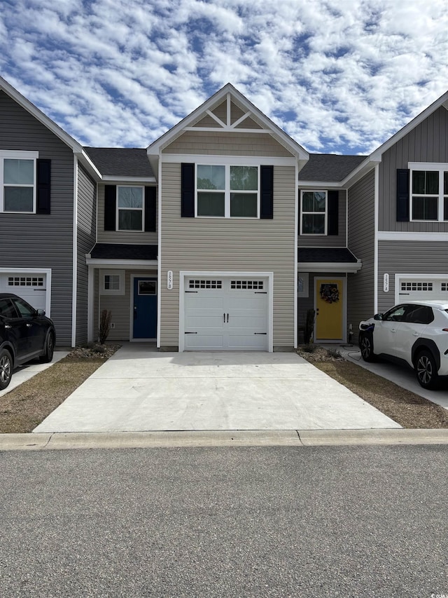 view of front of property featuring driveway and an attached garage