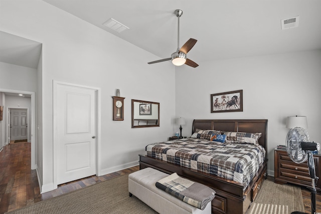 bedroom featuring visible vents, lofted ceiling, and wood finished floors