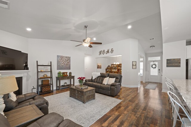 1201 Ficus Dr, Myrtle Beach, SC 29579 - living room with dark wood-style flooring, a ceiling fan, a fireplace, lofted ceiling, and recessed lighting