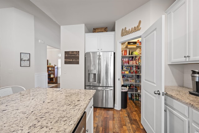 1201 Ficus Dr, Myrtle Beach, SC 29579 - kitchen featuring stainless steel fridge, dark wood finished floors, white cabinetry, and light stone countertops