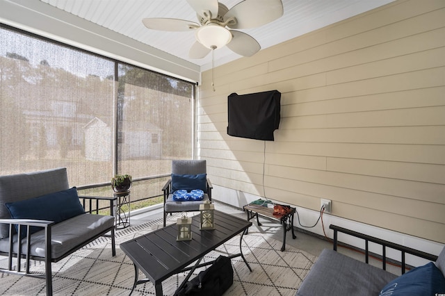 sunroom featuring ceiling fan