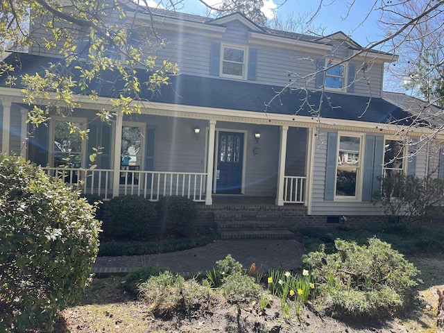 view of front of house featuring covered porch and crawl space