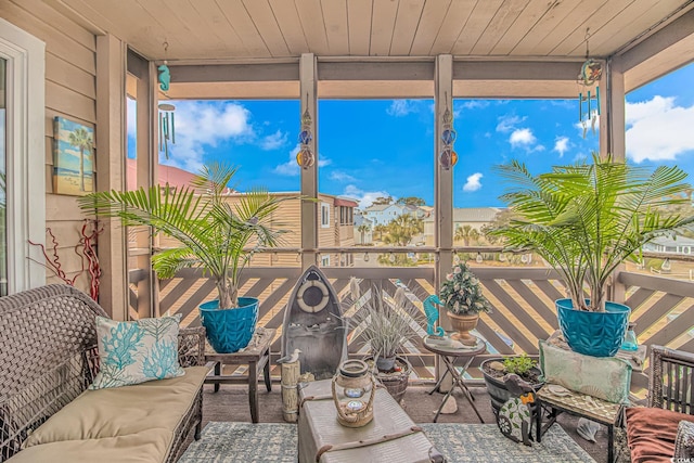 sunroom / solarium featuring wooden ceiling