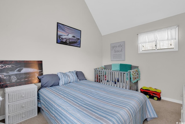 carpeted bedroom featuring vaulted ceiling and baseboards