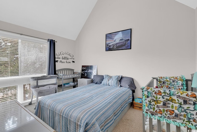 carpeted bedroom featuring vaulted ceiling