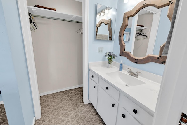 bathroom featuring vanity and baseboards