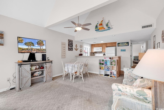 living room with visible vents, light carpet, ceiling fan, high vaulted ceiling, and baseboards